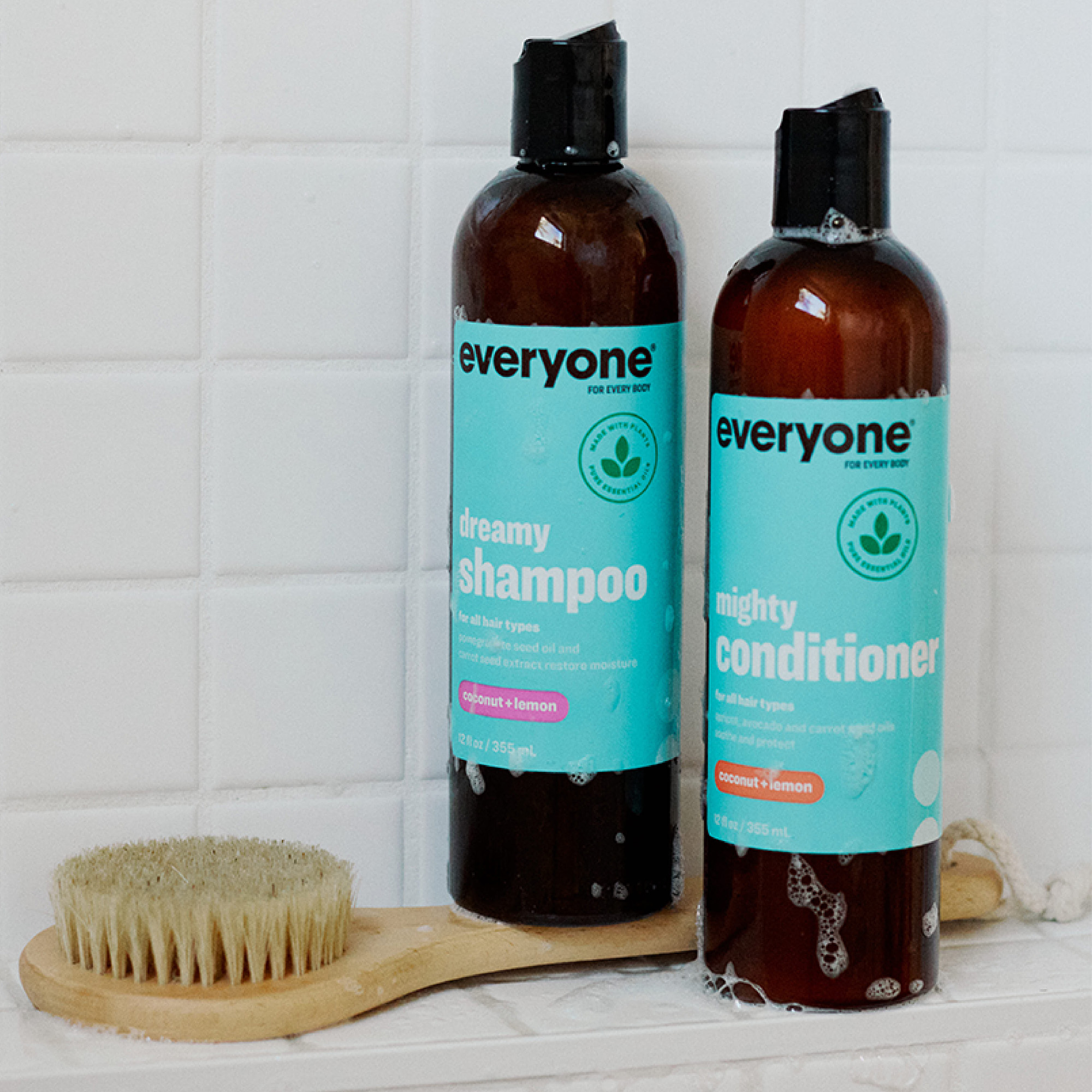 EO Hair ECO Erin non-toxic sustainability image of of shampoo bottles with loofa