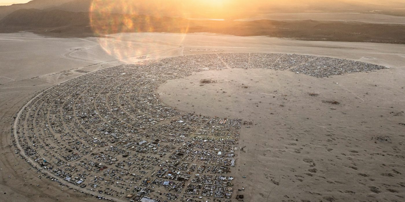 Burning Man sustainability showcased with an overhead image of Black Rock City. This image shows the semi circle clock shape of all the camps on a map.