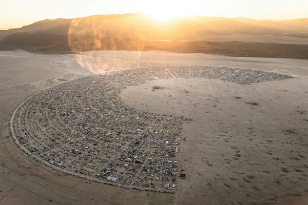Burning Man sustainability showcased with an overhead image of Black Rock City. This image shows the semi circle clock shape of all the camps on a map.
