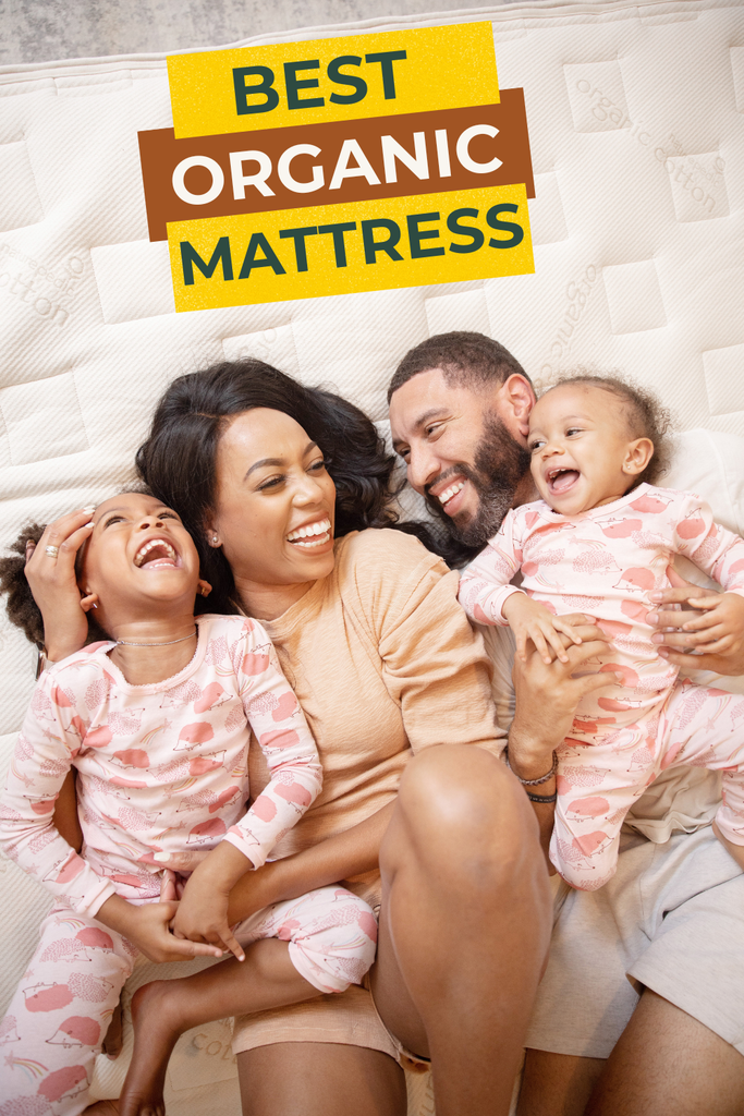 Image of a family of four laughing on top of an organic mattress 