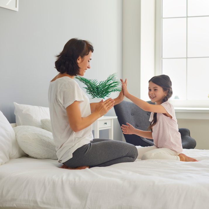 best organic mattress 2026 bed mother daughter playing on organic bed